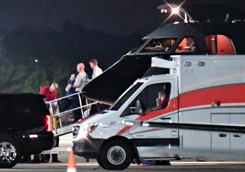 A person believed to be Otto Warmbier is transferred from a medical transport airplane to an awaiting ambulance at Lunken Airport in Cincinnati, Ohio. (REUTERS/Bryan Woolston)