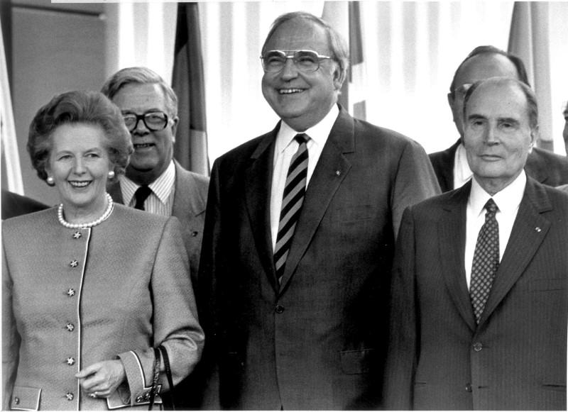 German Chancellor Helmut Kohl stands with Britain's Prime Minister Margaret Thatcher (L), Britain's Foreign Secretary Geoffrey Howe (back L) and France's President Francois Mitterrand (R) during a summit of the European Community in Hanover on June 27, 1988. (REUTERS/Michael Urban)