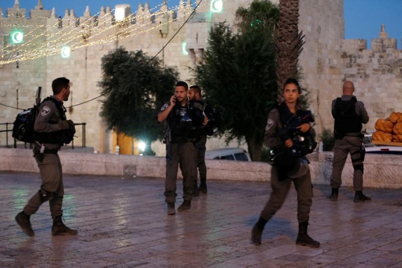 Israeli policemen secure the scene of the shooting and stabbing attack outside Damascus gate in Jerusalem's old city June 16, 2017. (REUTERS/Ammar Awad)