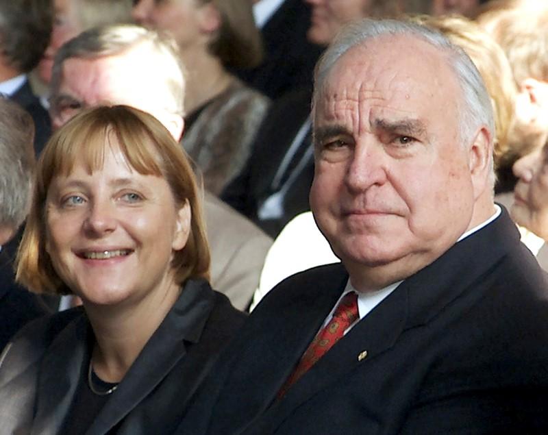 Former German Chancellor Helmut Kohl sits next to Christian Democrat party (CDU) leader Angela Merkel during celebrations to mark the 10th anniversary of German unification in Berlin on Sept. 27, 2000. (REUTERS/Michael Urban)