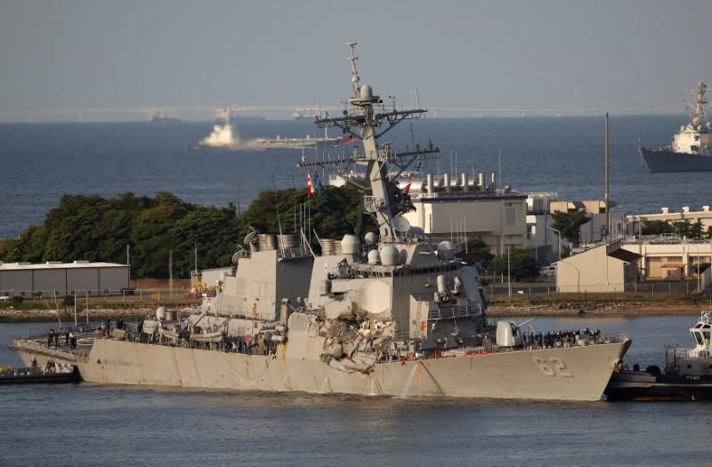 The Arleigh Burke-class guided-missile destroyer USS Fitzgerald, damaged by colliding with a Philippine-flagged merchant vessel, is towed by a tugboat upon its arrival at the U.S. naval base in Yokosuka, south of Tokyo, Japan June 17, 2017. (REUTERS/Toru Hanai)