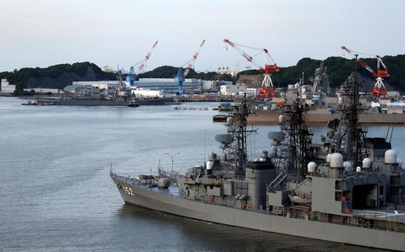 The Arleigh Burke-class guided-missile destroyer USS Fitzgerald, damaged by colliding with a Philippine-flagged merchant vessel, is towed into the U.S. naval base as Japanese Maritime Self-Defence Force (JMSDF) naval escort vessel Yamagiri is seen in front in Yokosuka, south of Tokyo, Japan on June 17, 2017. (REUTERS/Toru Hanai)