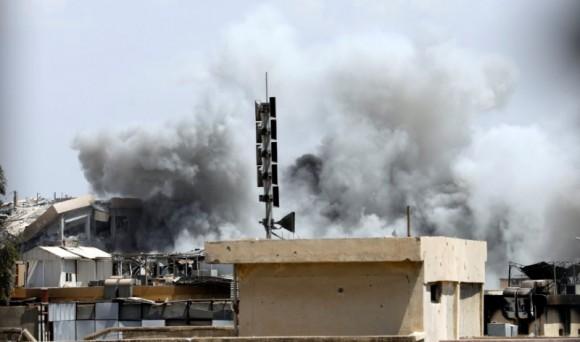 Smoke billows from the ISIS terrorists positions after an artillery attack by the Iraqi soldiers in western Mosul, Iraq June 18, 2017. (Reuters/Erik De Castro)