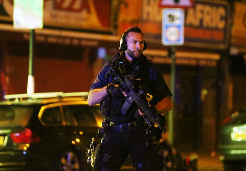 An armed police officer attends to the scene after a vehicle collided with pedestrians in the Finsbury Park neighborhood of North London, Britain on June 19, 2017. (REUTERS/Neil Hall)