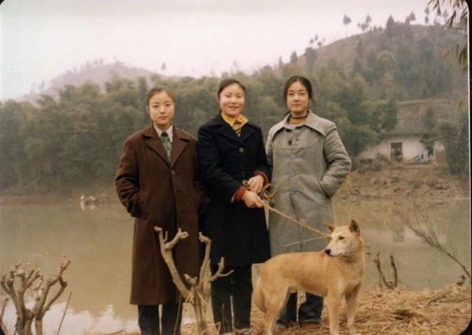 Jennifer Zeng (right) with her two sisters in the 1980's at Chaozhong village, Zhongjiang County, Sichuan Province in China. The mud wall house behind them was the family house passed on to many generations from their ancestors. Some of Jennifer's uncles and many of her cousins are still living in this house and village today. (Provided by Jennifer Zeng)