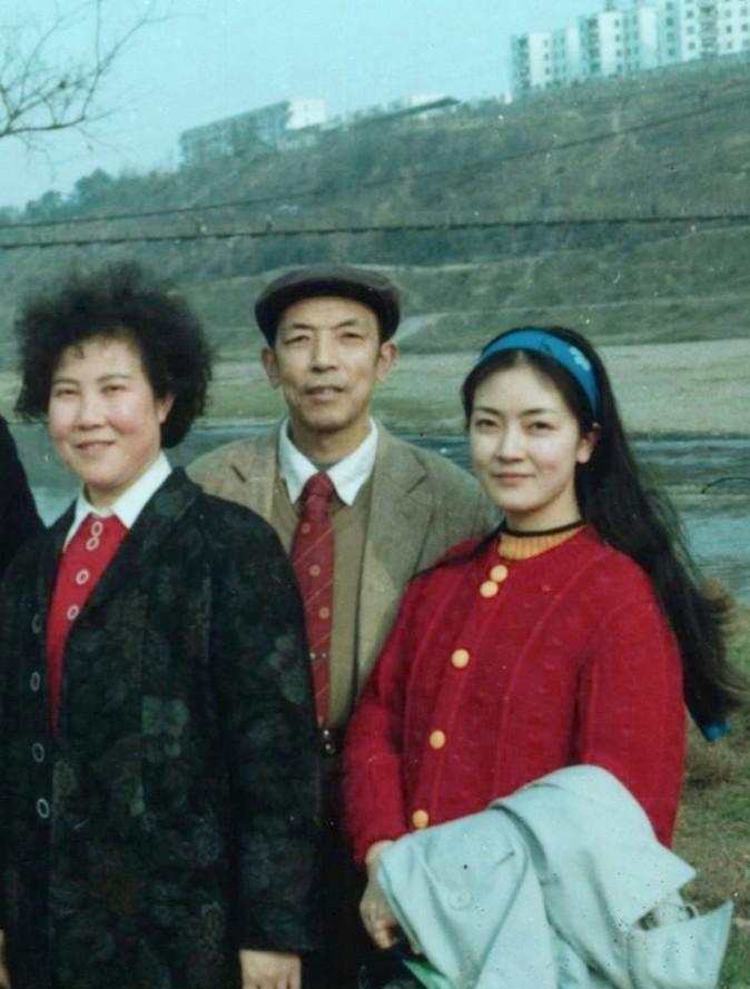 This photo taken in 1989 was the last one of Jennifer with both her parents. The hanging bridge in the background leads to Jennifer's high school, Mianyang Nanshan High School. (Provided by Jennifer Zeng)