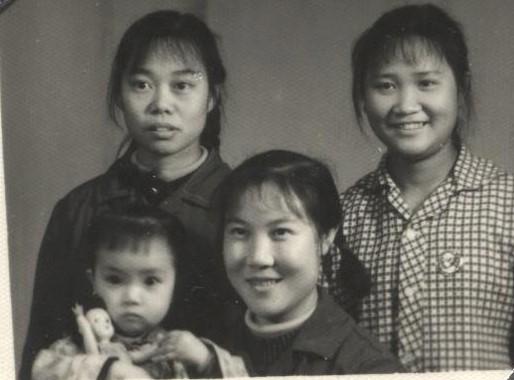 Jennifer's mother, her two friends and two-year-old Jennifer. As the first child in the family, Jennifer enjoyed some "special" treatment such as having a doll of her own. After her two younger sisters were born, her parents no longer had the ability to buy more dolls for her sisters. (Provided by Jennifer Zeng)