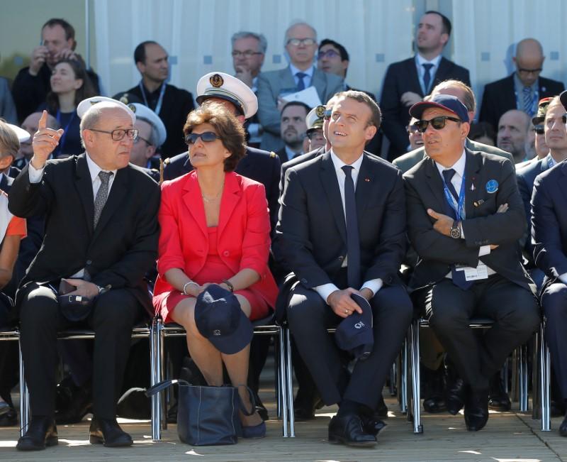 French President Emmanuel Macron (2ndR), French defense minister Sylvie Goulard (2ndL), Dassault Aviation CEO Eric Trappier (R) and French Foreign Affairs minister Jean-Luc Le Drian watch demonstration flights as part of the inauguration of the 52nd Paris Air Show in Le Bourget, north of Paris, France, June 19, 2017. (REUTERS/Michel Euler/Pool)