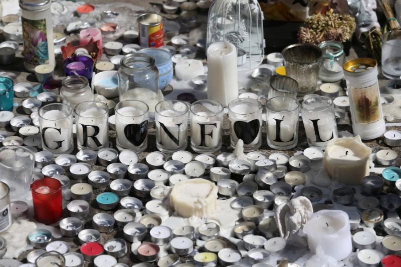 A tribute to the victims of the Grenfell Tower fire is seen in North Kensington, London, Britain on June 19, 2017. (REUTERS/Marko Djurica)