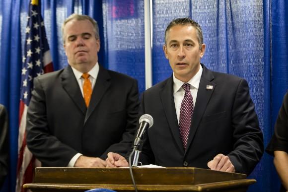 Assistant Special Agent in charge of Homeland Security Investigations, New York, Jason Molina (R) and Nassau Police Commissioner Thomas Krumpter at a press conference to announce the 85-count indictment of 41 alleged MS-13 gang members in Nassau County, Long Island, N.Y., on June 15, 2017. (Samira Bouaou/The Epoch Times)