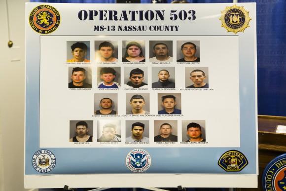 Eighteen of the alleged MS-13 gang members named in the 85-count indictment, including eight attempted murders, in Nassau County, Long Island, N.Y., on June 15, 2017. (Samira Bouaou/The Epoch Times)