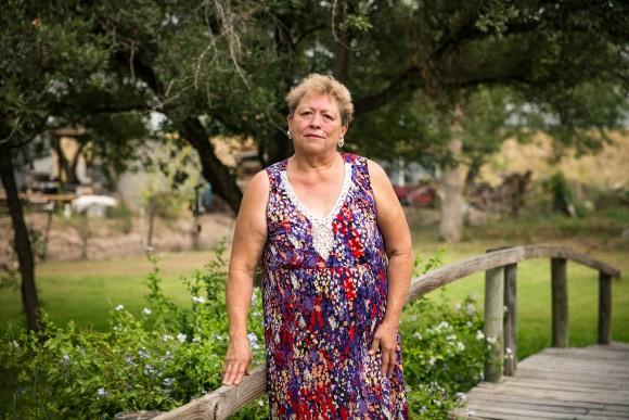 Gloria Garza stands in her backyard, where illegal immigrants have poured through in the last few years, in Granjeno, Texas, on May 28, 2017. (Benjamin Chasteen/The Epoch Times)