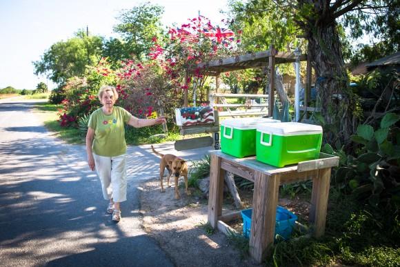 Pamela Taylor leaves coolers with ice and drinks next to her mailbox for Border Patrol, illegal immigrants, and "anyone else who is thirsty," in Brownsville, Texas, on June 1, 2017. (Benjamin Chasteen/The Epoch Times)