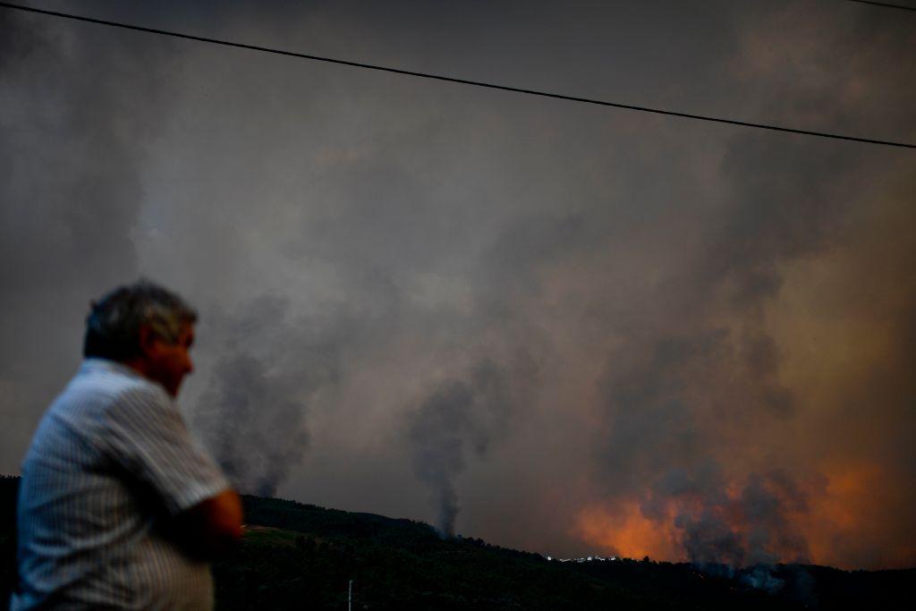A man watches a wildfire in the village of Carvalhal, in Gois on June 20, 2017.<br/>(PATRICIA DE MELO MOREIRA/AFP/Getty Images)