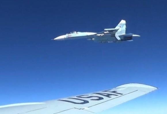 A Russian SU-27 fighter jet within several feet of a U.S. RC-135 recon aircraft on June 19, 2017. (Courtesy photo/Released)