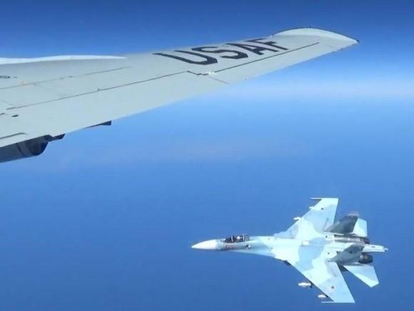 A U.S. RC-135U flying in international airspace over the Baltic Sea being intercepted intercepted by a Russian SU-27 Flanker June 19, 2017. (Courtesy photo/Released)