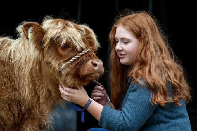 18-year old Laura Hunter with her Highland calf before the 177th Royal Highland Show in Edinburgh, Scotland, on June 23. The Royal Highland Show is Scotland's annual farming and countryside showcase, organized by the Royal Highland and Agricultural Society of Scotland. (Robert Perry/Getty Images)