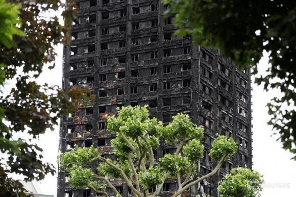 Damage to Grenfell Tower is seen following the catastrophic fire, in north Kensington, London, Britain, June 25, 2017. (Reuters/Peter Nicholls)