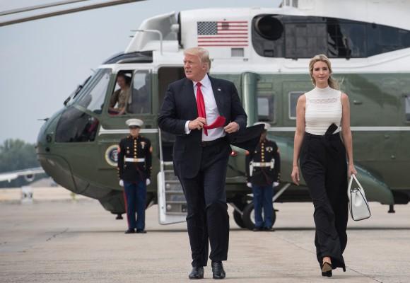 US President Donald Trump waves as he walks with his daughter Ivanka to board Air Force one at Andrews Air Force Base in Maryland en route to Milwaukee, Wisconsin on June 13, 2017. (NICHOLAS KAMM/AFP/Getty Images)