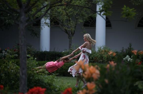 Ivanka Trump (R), daughter and assistant to President Donald Trump, plays with her daughter Arabella Rose Kushner (L) in the Rose Garden during during a Congressional Picnic on the South Lawn of the White House in Washington on June 22, 2017. (Alex Wong/Getty Images)