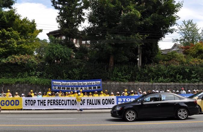 Falun Gong practitioners hold a rally outside the Chinese Consulate in Vancouver on June 25, 2017, calling for the release of Canadian citizen Sun Qian who is currently detained in China for practising Falun Gong. (Feng Tang/The Epoch Times)
