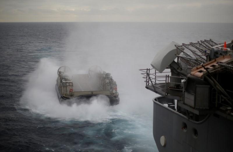 A U.S. Navy Landing Craft Air Cushion (LCAC) appears from the stern of the USS Bonhomme Richard amphibious assault ship during events marking the start of Talisman Saber 2017, a biennial joint military exercise between the United States and Australia, off the coast of Sydney, Australia July 29, 2017. (REUTERS/Jason Reed)