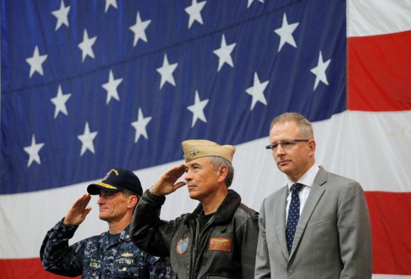 (L-R) U.S. Navy Rear Admiral Marc Dalton, Commander of the U.S. Pacific Command Admiral Harry Harris and Australian Minister for Urban Infrastructure Paul Fletcher participate in a ceremony marking the start of Talisman Saber 2017, a biennial joint military exercise between the United States and Australia aboard the USS Bonhomme Richard amphibious assault ship in the Pacific Ocean off the coast of Sydney, Australia, June 29, 2017. (REUTERS/Jason Reed)