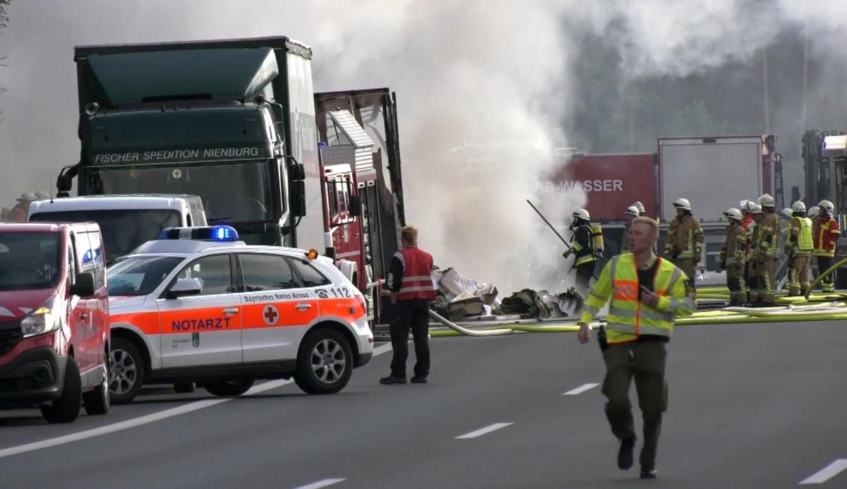 Firefighters are seen at the site where a coach burst into flames after colliding with a lorry on a motorway near Muenchberg, Germany in this still image taken from video on July 3, 2017. (REUTERS/News 5)