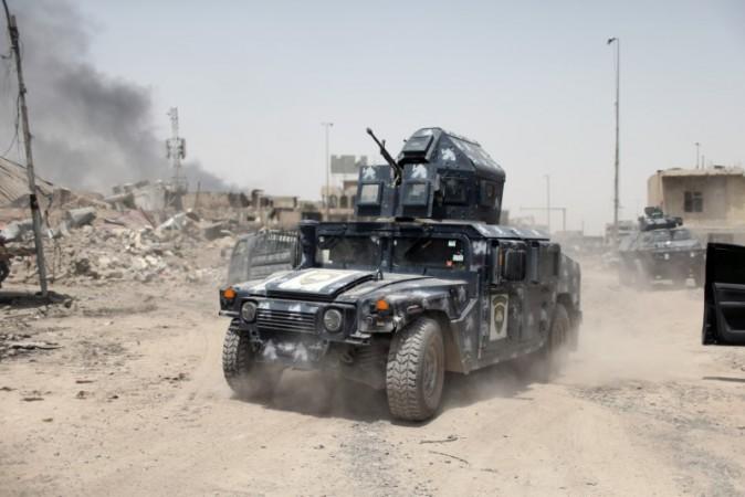 A military vehicle of the Emergency Response Division is seen during the fight with the ISIS terrorists in the Old City of Mosul, Iraq, July 3, 2017. (REUTERS/Ahmed Jadallah)