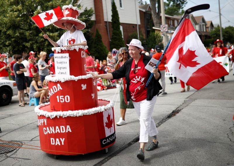 People participate in the East York Toronto Canada Day parade, as the country marks its 150th anniversary with "Canada 150" celebrations, in Toronto, Ontario, Canada on July 1, 2017. (REUTERS/Mark Blinch)