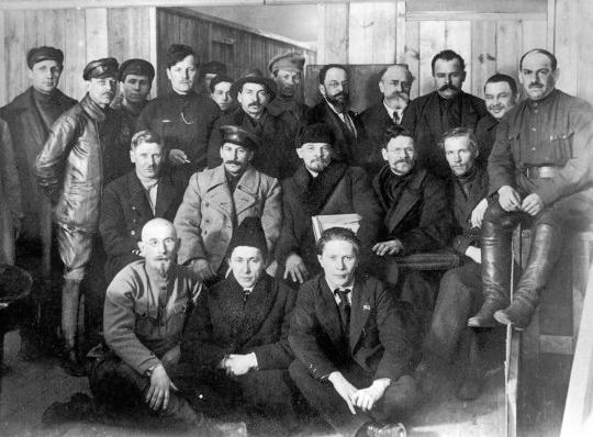 In the second row, starting from second left, are pictured Joseph Stalin, Vladimir Lenin, and Leon Trotsky as they gather for a meeting of the 8th Congress of the Bolshevik (later Soviet Communist) Party in 1919. (Public Domain)