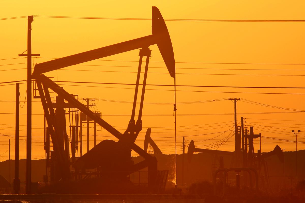Pump jacks are seen at dawn in an oil field over the Monterey Shale formation where gas and oil extraction using hydraulic fracturing, or fracking, is on the verge of a boom on March 24, 2014 near Lost Hills, California. (David McNew/Getty Images)