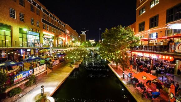 The Bricktown entertainment district at night. (Oklahoma City Convention & Visitors Bureau)