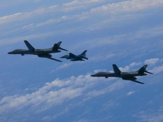 Two U.S. Air Force B-1B Lancers fly with a Koku Jieitai (Japan Air Self-Defense Force) F-2 fighter jet over the East China Sea, July 7, 2017. (Japan Air Self-Defense Force)