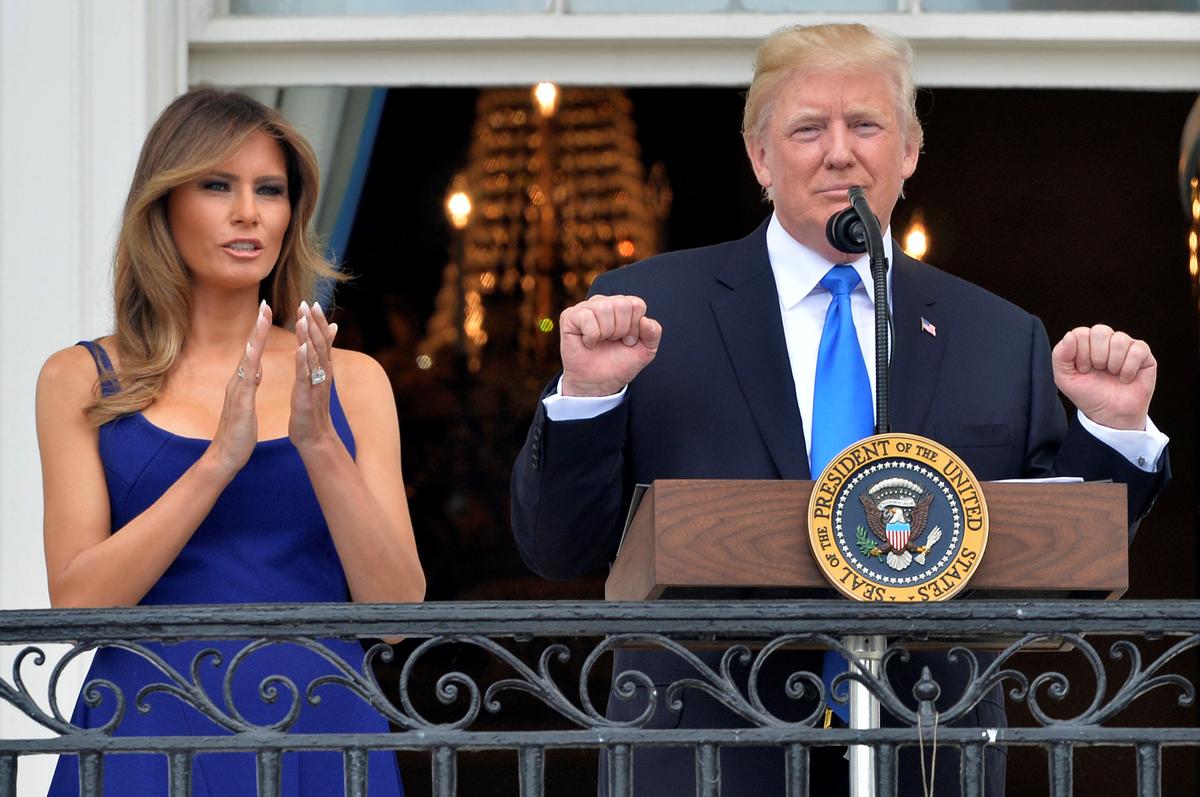President Trump concludes his remarks while First Lady Melania Trump applauds as they welcome military families on the South Lawn of the White House. (Reuters/Mike Theiler)