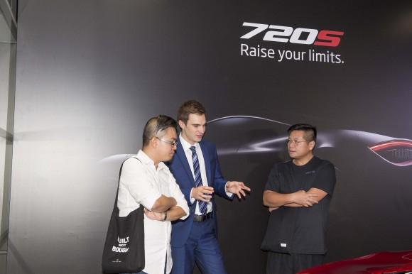 Peter Sell Regional Sales Manager of McLaren Automotive Asia talking with guests at the McLaren 720S at the Wanchai showroom during the launch event in Hong Kong on June 29, 2017. (Bill Cox/Epoch Times)