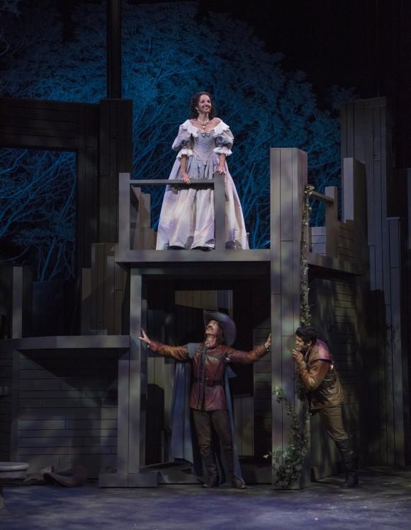 In the most famous scene of the play, (L–R) Roxane (Laura Rook) is wooed by Cyrano (James Ridge) for Christian (Danny Martinez) who lacks the ability to speak beautifully. (Michael Brosilow)