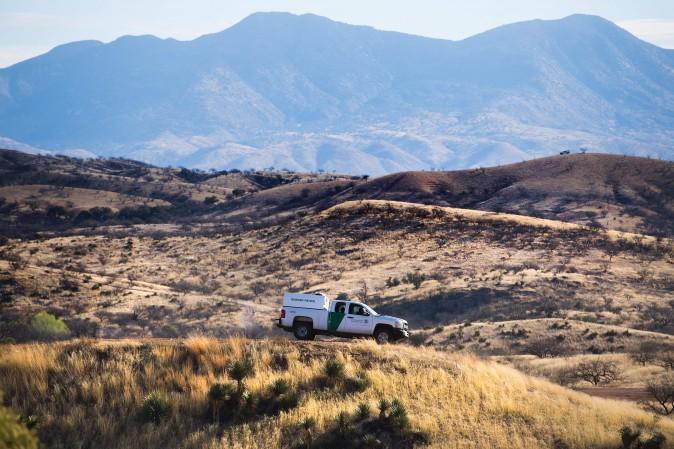 A U.S. Border Patrol agent parks on a hill top near the border fence in Nogales, Arizona, on Feb. 17, 2017, on the US/Mexico border. (Jim Watson/AFP/Getty Images)