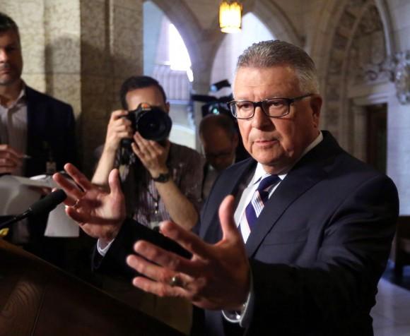 Public Safety Minister Ralph Goodale holds a news conference on Parliament Hill on July 7, 2017, announcing a payout and apology to Omar Khadr. (The Canadian Press/Fred Chartrand)