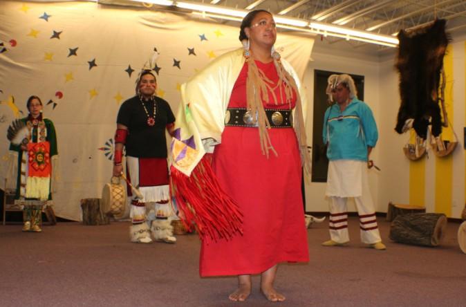 Lakota Ways, teaching visitors different dances and stories of Lakota pople. Kiri Close in Red, Joseph Shopbell on the far right, Tyler One Horn in Black and Adonica Little-Sky on the far left. (Myriam Moran copyright 2014)