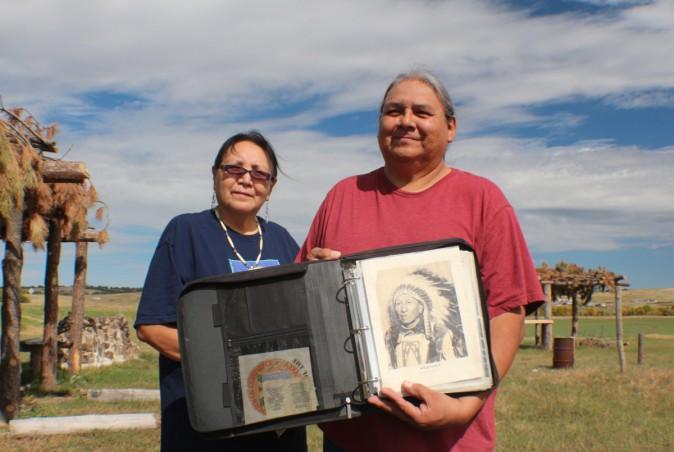 Emerson Elk and his wife Jerilyn holding the photograph of Howard Bad Bear his Great Grand Father who died at the Massacre of Wounded Knee. (Myriam Moran copyright 2014)
