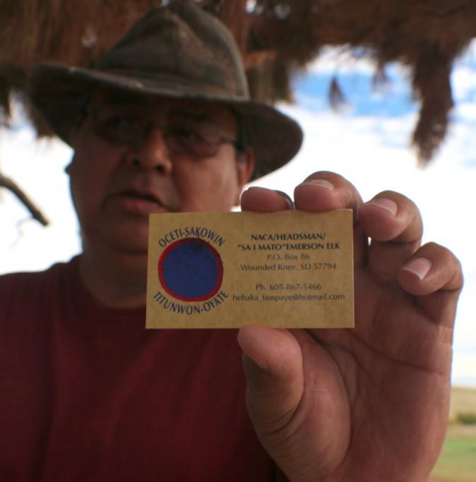 Emerson Elk Holding his business card with his Lakota name Sa I Mato Emerson Elk. (Myriam Moran copyright 2014)