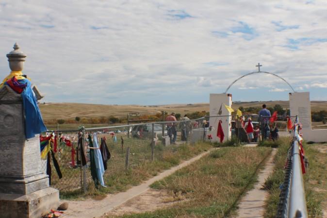 The Wounded Knee Cemetery with ribbons placed by tribal members as a sign of their respect and prayers for the dead. (Myriam Moran copyright 2014)