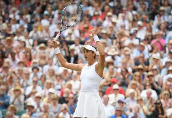 Spain's Garbine Muguruza celebrates winning the semi final match against Slovakia's Magdalena Rybarikova at Wimbledon in London, July 13, 2017. (Reuters/Toby Melville)