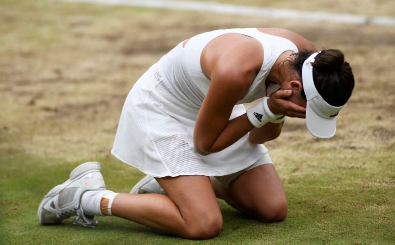 Tennis - Wimbledon - London, Britain - July 15, 2017 Spain's Garbine Muguruza celebrates winning the final against Venus Williams of the U.S. REUTERS/Tony O'Brien