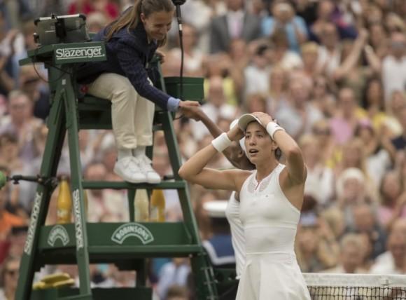 Garbine Muguruza celebrates match point during her women's finals match against Venus Williams on day twelve at the All England Lawn Tennis and Croquet Club, in London, Jul 15, 2017. (Susan Mullane/USA Today Sports)