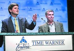 AOL Chairman Steve Case (L) and Time Warner Chairman Gerald Levin announce their companies' merger on Jan. 10, 2000. The $164 billion merger failure is one of the symbols of the 1990s tech bubble. Unrealistic dreams about the future pushed stock valuations to unsustainable valuations, until the bubble popped. (STAN HONDA/AFP/GETTY IMAGES)