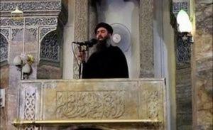 Leader of ISIS Abu Bakr al-Baghdadi at a mosque in the center of Iraq's second city, Mosul, according to a video recording posted on the Internet on July 5, 2014. (REUTERS/Social Media Website via Reuters TV)
