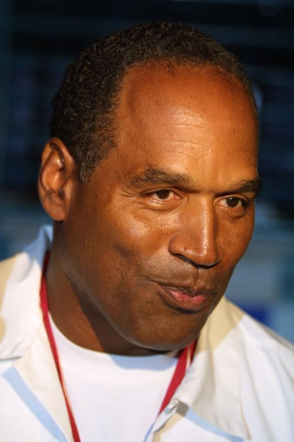 O.J. Simpson talks to the media as he attends the hip-hop concert the "The First Damn Birthday Jam" Aug. 24, 2001, at TECO arena in Estero, Florida. (Joe Raedle/Getty Images)
