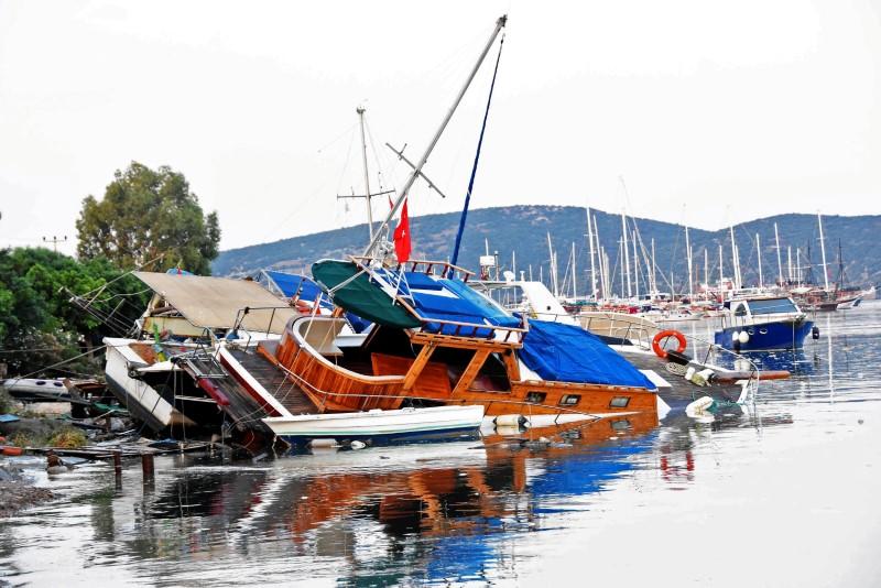 Damaged boats are seen after an earthquake and a tsunami in the resort town of Gumbet in Mugla province, Turkey, July 21, 2017. Yasar Anter/Dogan News Agency via REUTERS